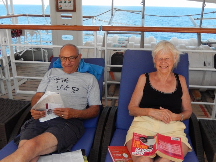 <em>Gentleperson farmers reading for pleasure, Jim and Ginny Eisenstein. </em>