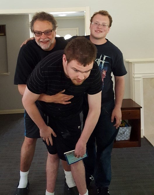 <p><em>Ben’s fraternal twin brother Jake and me with Ben at his group home, Father’s Day 2016</em></p>