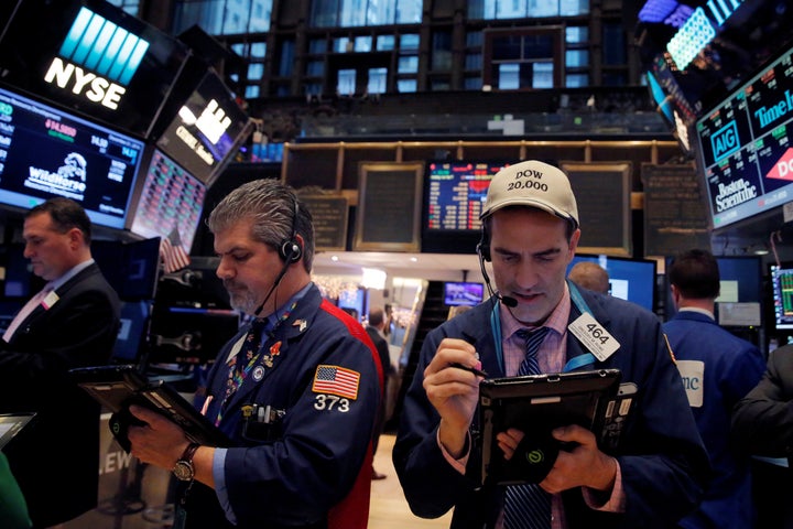 Traders work on the floor at the New York Stock Exchange (NYSE) in Manhattan, New York City, U.S., December 21, 2016.