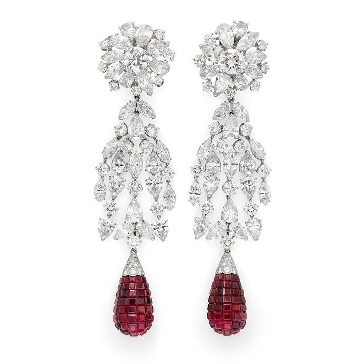 Simon Teakle’s Van Cleef & Arpels’  platinum ruby and diamond earrings with a flexible cascade of circular, pear and marquise cut diamonds suspending a central invisibly set ruby drop, three components detachable to wear in four different ways.New York circa 1930s. 