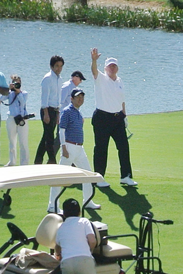 President Donald Trump with Japan's Prime Minister Shinzo Abe golfing at the president's Trump National Doral course.