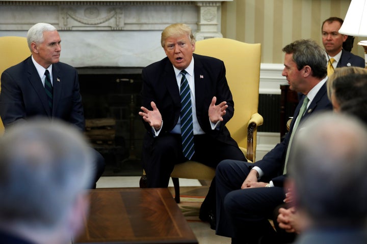 President Donald Trump and Vice President Mike Pence meet with U.S. Rep. Mark Walker (R-N.C.) and members of the Republican Study Committee about his proposed budget at the White House in Washington on Friday.