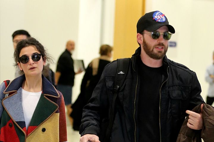 Chris Evans (R) and actress Jenny Slate (L) arrive at Sydney Airport in Sydney, New South Wales.