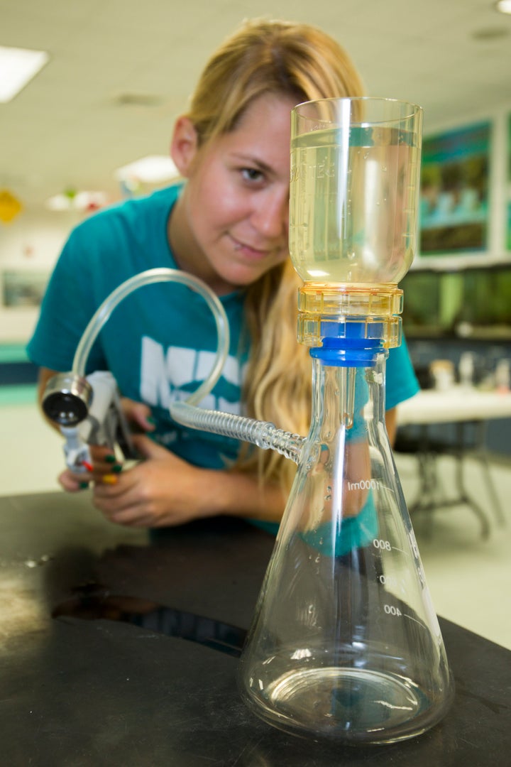 After collecting one-liter water samples, volunteers analyzed the water at designated locations that had appropriate filtration equipment.