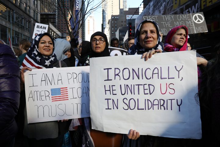Women wearing U.S. flag hijabs gather at an "I Am Muslim Too" rally in New York City last month.