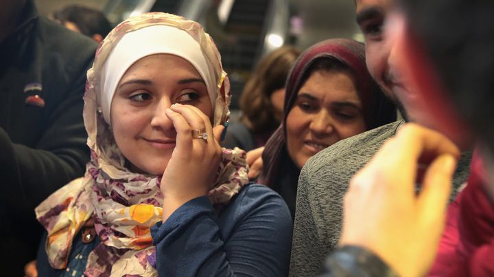 Syrian refugee Baraa Haj Khalaf wipes away a tear after arriving at O'Hare Airport with her family on a flight from Istanbul, Turkey on February 7, 2017.