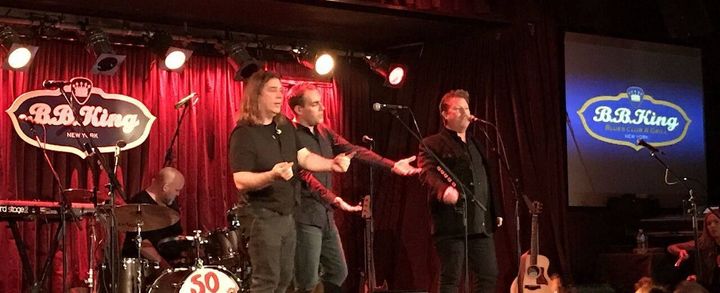 A Great Big Sea semi-reunion: Kris Macfarlane, Alan Doyle, Murray Foster, and Bob Hallett together onstage for “Come and I Will Sing You.”
