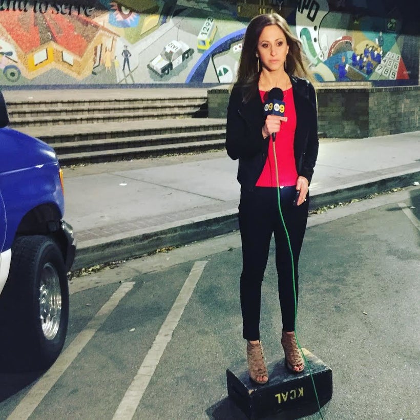 Standing on a small box to be the right height for a live shot.