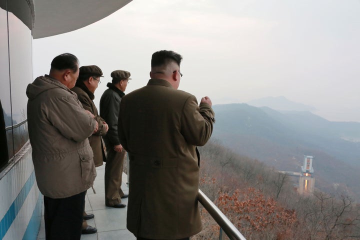 North Korean leader Kim Jong Un, right, watches a ground jet test. Earlier this month, Pyongyang launched four ballistic missiles and conducted a rocket engine test that Kim said opened “a new birth” of its rocket industry.