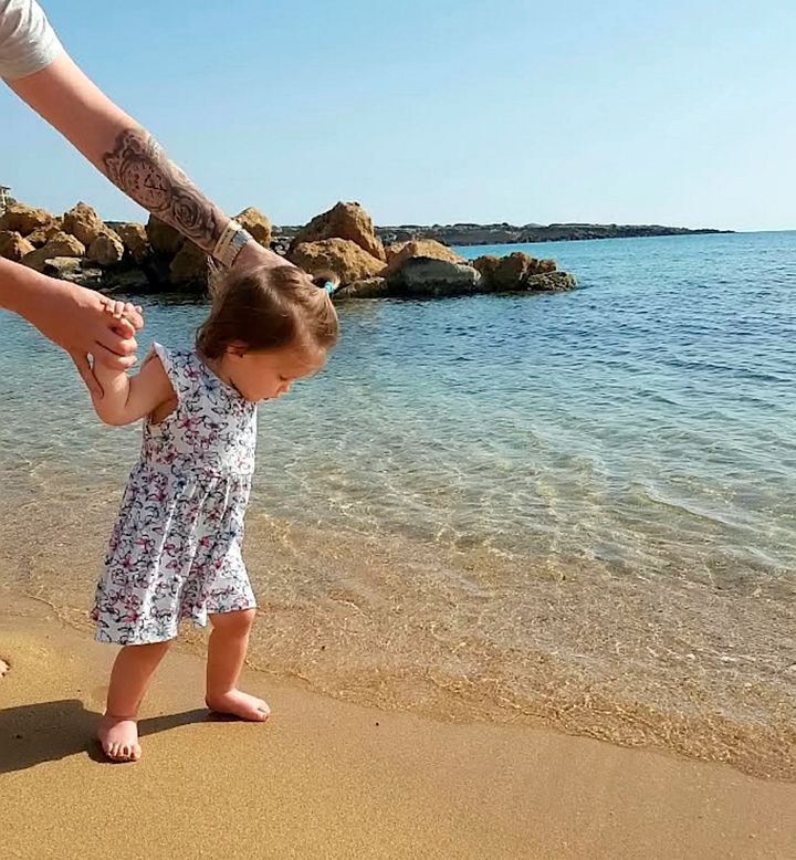 Harper walking in the sea during the holiday 