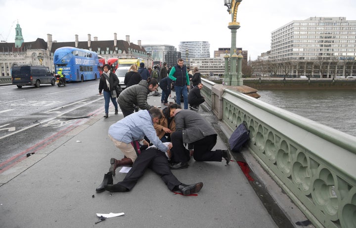 People rushed to treat the injured after the attack on Westminster Bridge.