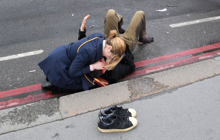 A vehicle plowed into pedestrians on Westminster Bridge before driving onto the sidewalk in front of the gates of Parliament.