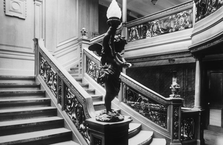 Both companies have offered to provide first-hand views of the ship's grand staircase, seen above before before Titanic sank in 1912. 