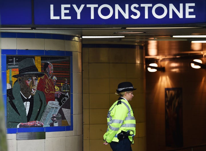 A police officer stands on duty outside Leytonstone Underground station in east London, Dec. 7, 2015.