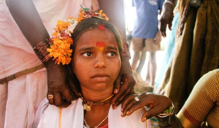 <p>A young girl being married off to a temple deity</p>