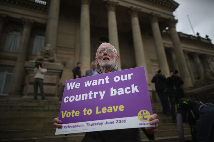 A campaigner holds a placard calling for the U.K. to leave the European Union. 