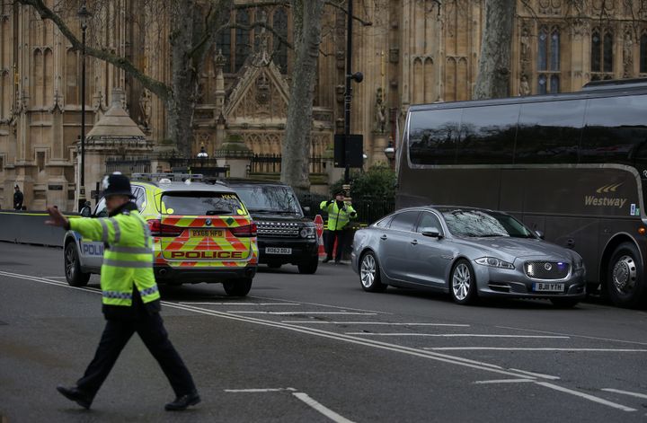 The Jagaur car of Prime Minister Theresa May is driven away from the Houses of Parliament during the incident