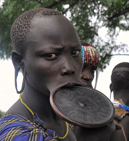 <p>A Mursi woman displays her lip plate.</p>