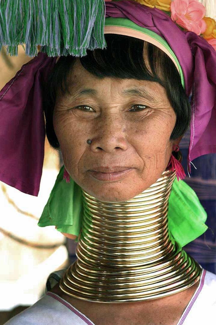 <p>A Kayan woman displays her neck rings. </p>