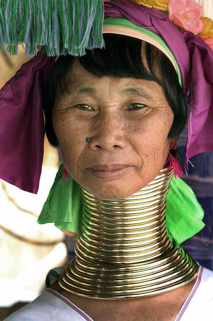 <p>A Kayan woman displays her neck rings. </p>