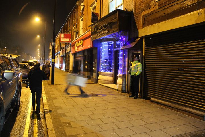 A police officer stand outside an address in Hagley Road, Birmingham, where armed police have raided a flat overnight.