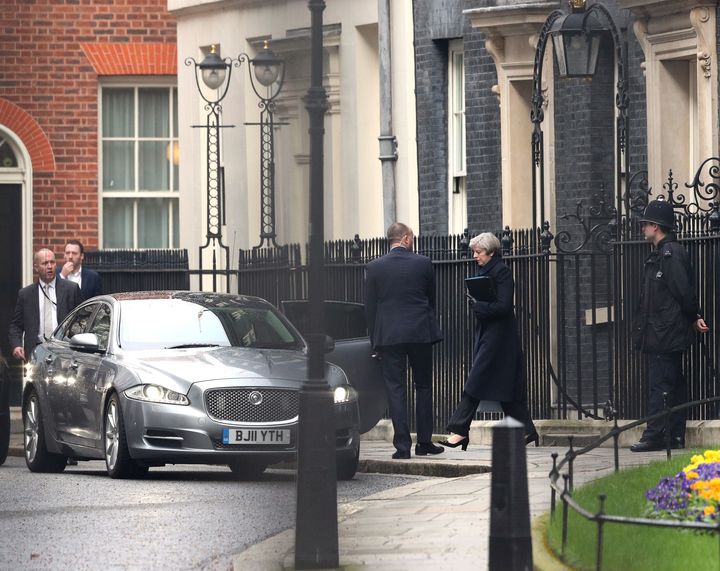 Theresa May leaves 10 Downing Street to travel to work