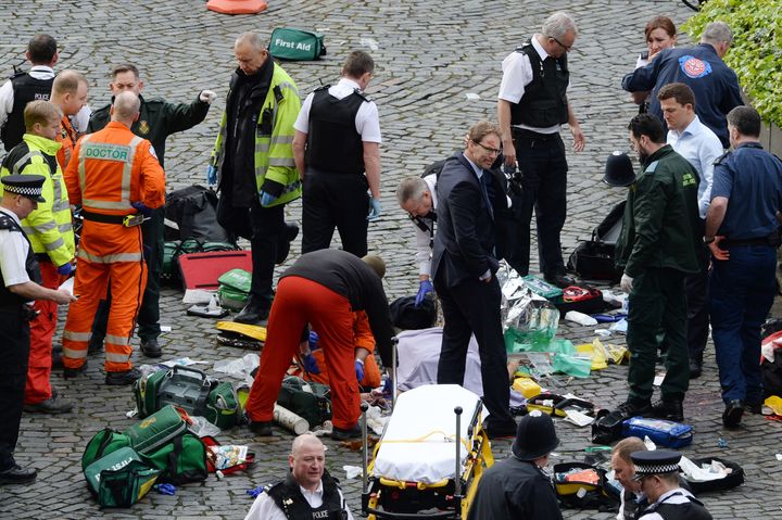 Tobias Ellwood stands amongst a crowd of first responders