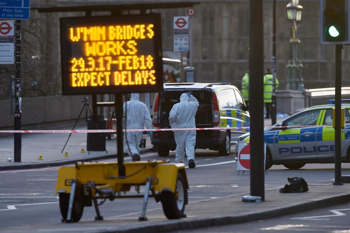 Forensics investigators work at the scene after an attack on Westminster Bridge on Wednesday
