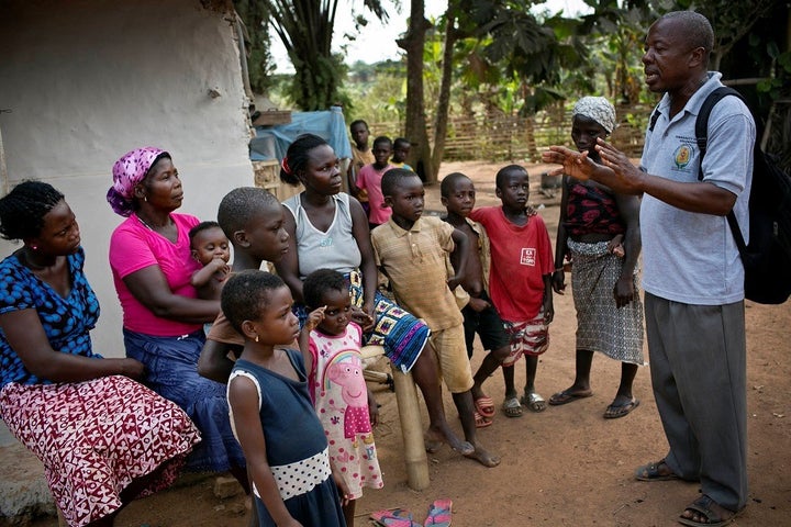 <p><em>A community health volunteer promoting health messages in Ghana.</em></p>