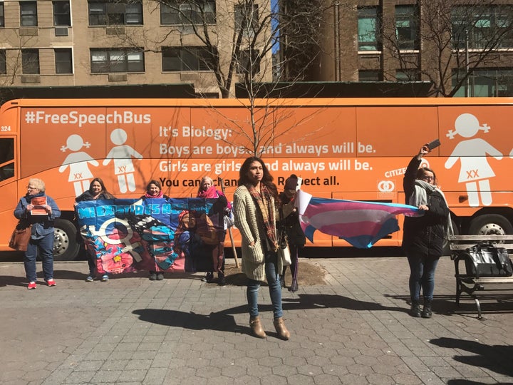 LGBTQ advocacy groups protest in front of the “Freedom Speech Bus” in New York City on March 23.