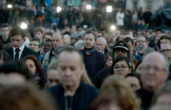 People observe the minute's silence