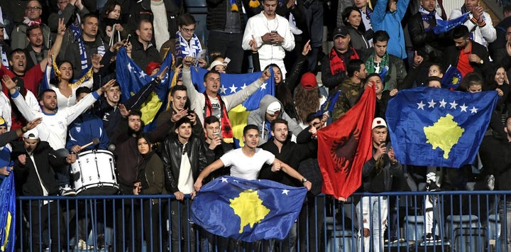 <p>Kosovo fans cheer as their team takes on Finland at a September 2016 football match. </p>