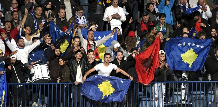 Kosovo fans cheer as their team takes on Finland at a September 2016 football match. 