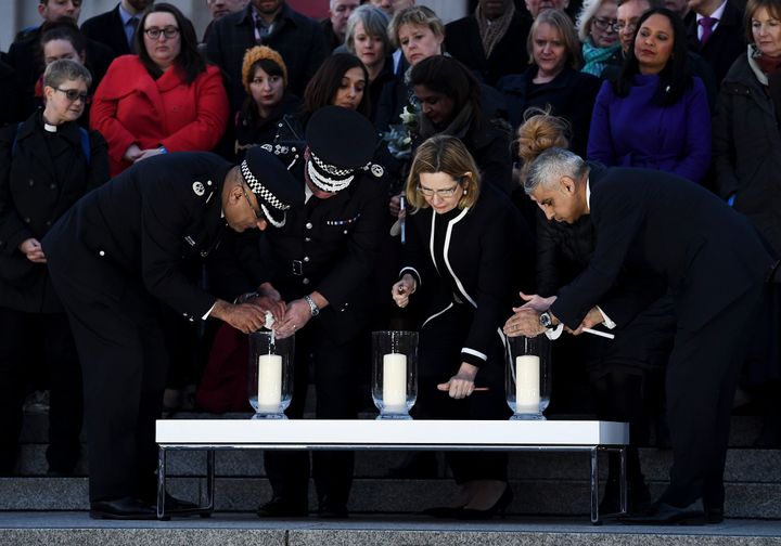 Acting Commissioner of the Metropolitan Police Craig Mackey, Home Secretary Amber Rudd MP and Mayor of London Sadiq Khan light candles at the vigil