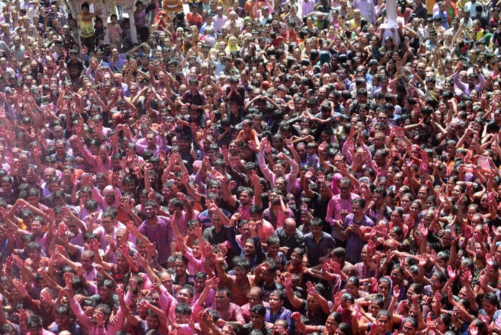 Indian Hindu devotees celebrate the Holi festival at the Swaminarayan Temple in Ahmedabad on March 13, 2017. The Hindu festiv