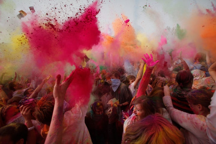 Revellers throw coloured powder during Holi at the Sri Sri Radha Krishna Temple in Spanish Fork, Utah, March 26, 2011.