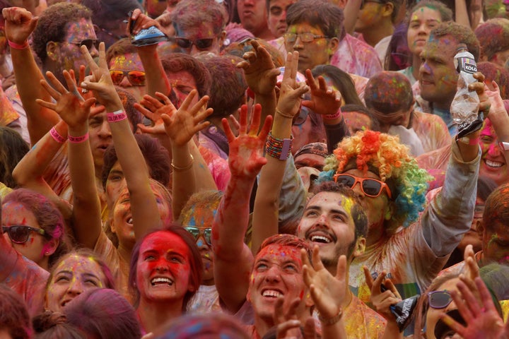 Participants are covered in colored powder as they celebrate in The Color Run in Lima, Peru, August 14, 2016.