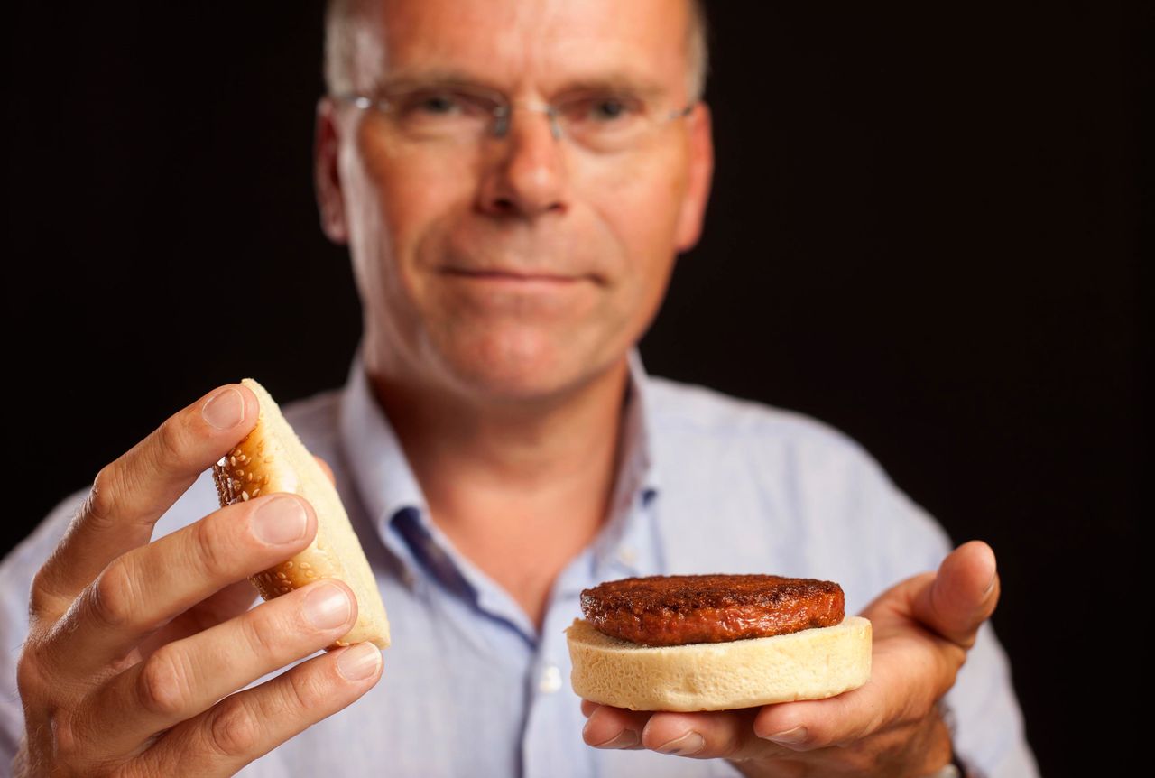 Mark Post poses with the world's first lab-grown beef patty in 2013. 