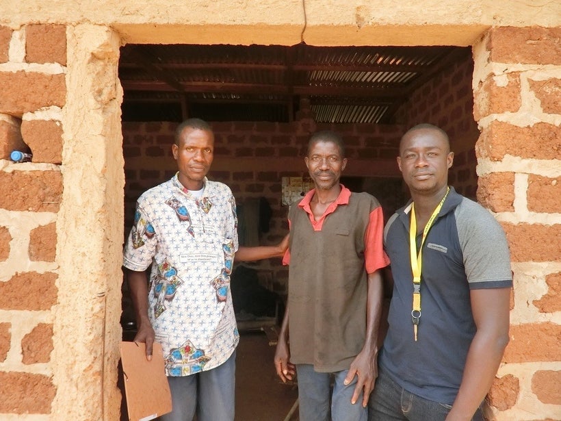 Loukou Kouame with community health workers at his home in Djangokro, Côte d’Ivoire.
