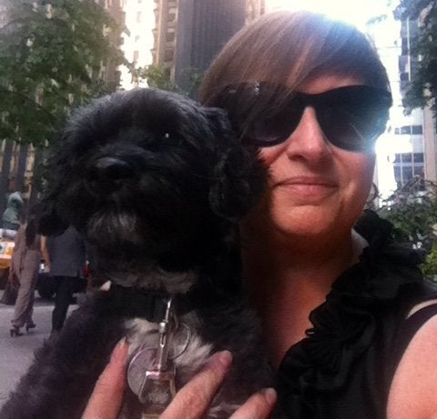 Leah Borenstein takes a selfie with Sooner, her Shih-Poo therapy dog.