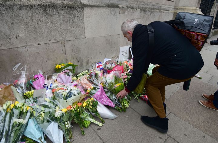 Floral tributes are left outside the Houses of Parliament