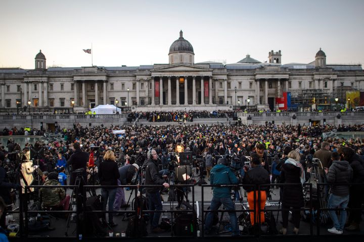 People attending a candlelight vigil in Trafalgar Square to remember those who lost their lives in the attack