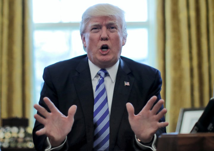 President Donald Trump reacts to the AHCA health care bill being pulled by Congressional Republicans before a vote as he speaks about the bill in the Oval Office on Friday.