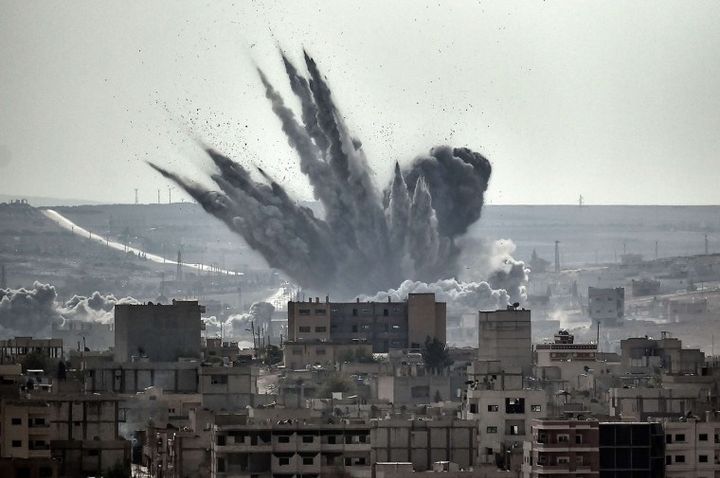 <p>A shell explodes in the Syrian city of Kobane</p>
