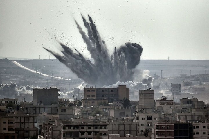 A shell explodes in the Syrian city of Kobane