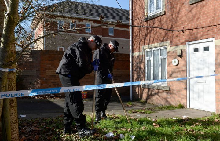 Police search the garden of a property on Navigation Way in Hockley, Birmingham.