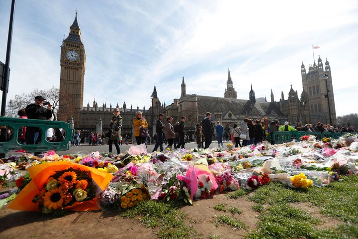 Floral tributes are seen in Parliament Square on Saturday.