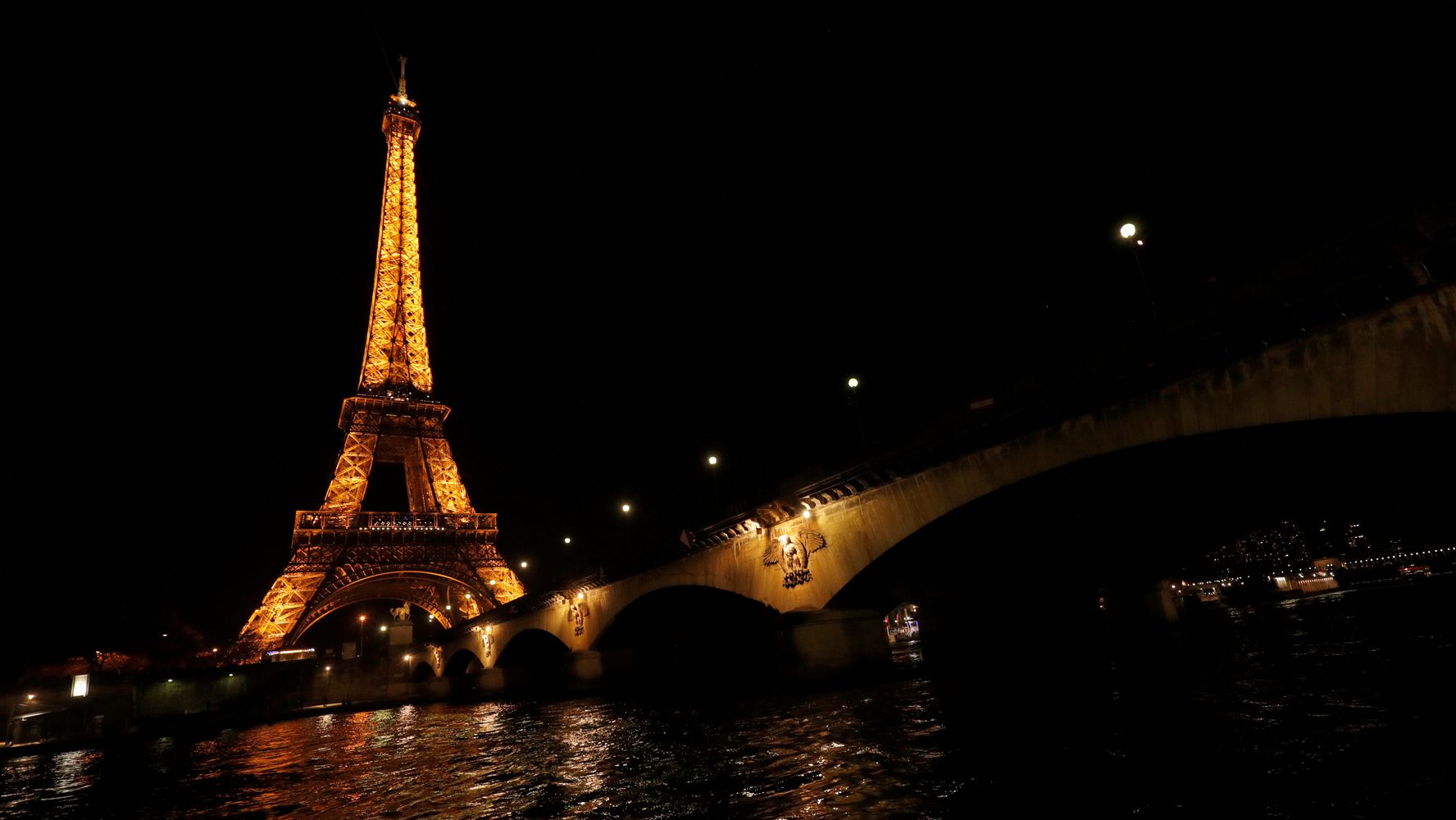 Lights go out. Hour of Earth Eiffel Tower. Earth hour in Paris.