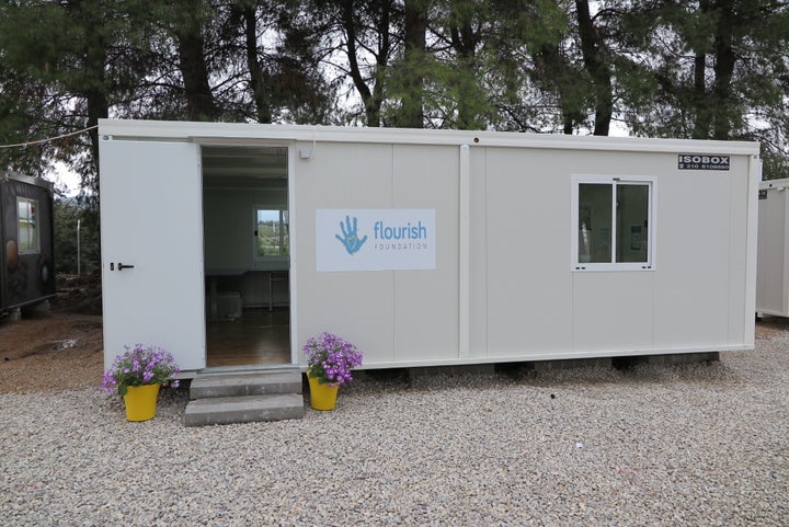 <p>“Last week we saw the arrival of our dedicated art therapy room, in the form of a large isobox. This provides us with a space that we can regularly hold our group open art therapy sessions. We were unsure as to how it would be received by the residents but it has so far been welcomed as a space with a specific purpose and as a sanctuary for the individuals within the camp.” - Flourish Foundation</p>