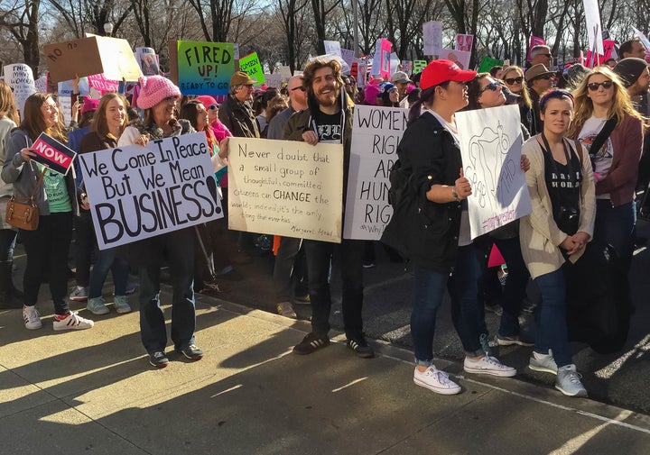 Endless but mellow line at the ATM to deposit paychecks after the Chicago Women’s March